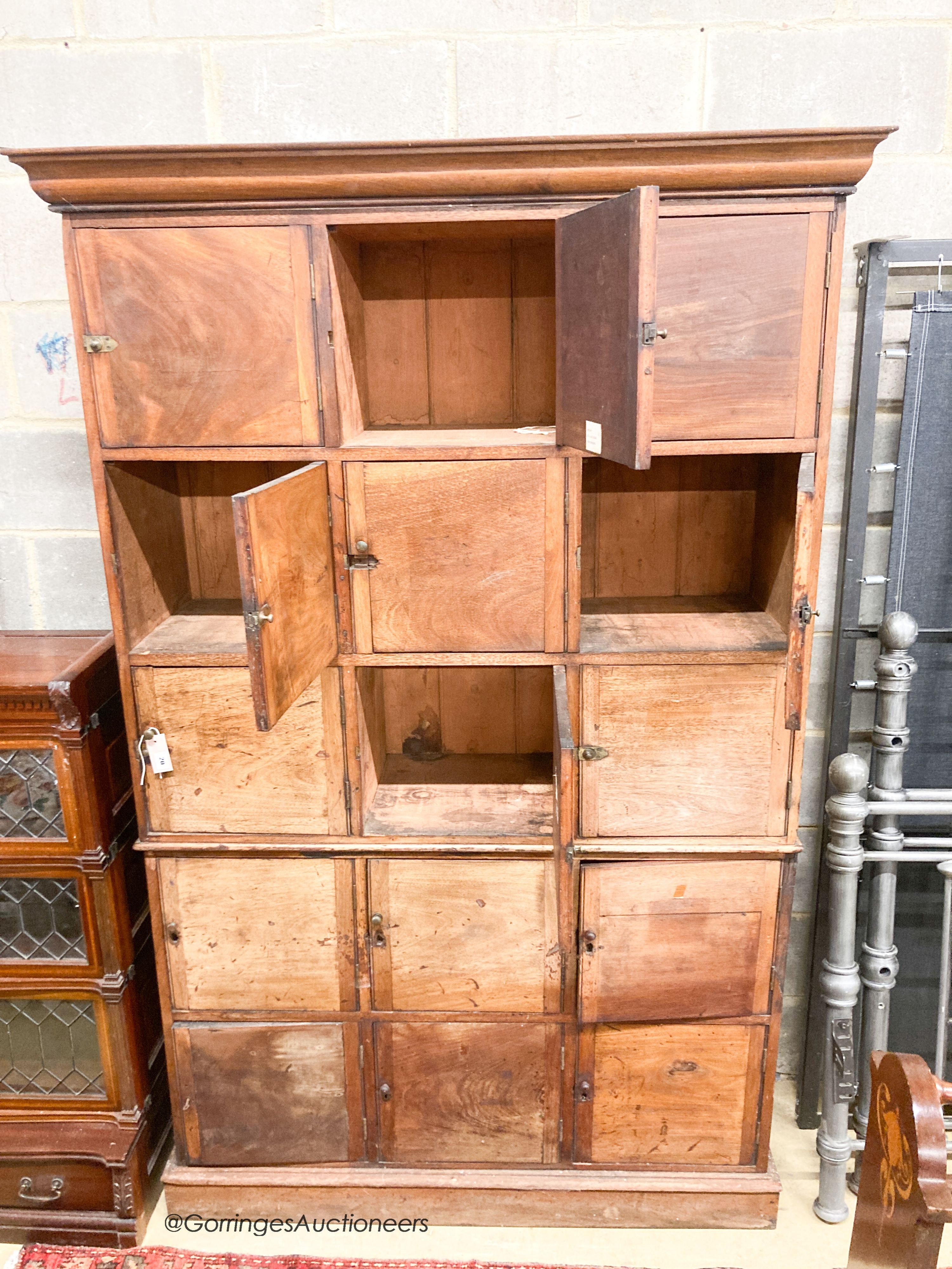 A 19th century mahogany stationery cupboard, width 130cm, depth 47cm, height 204cm